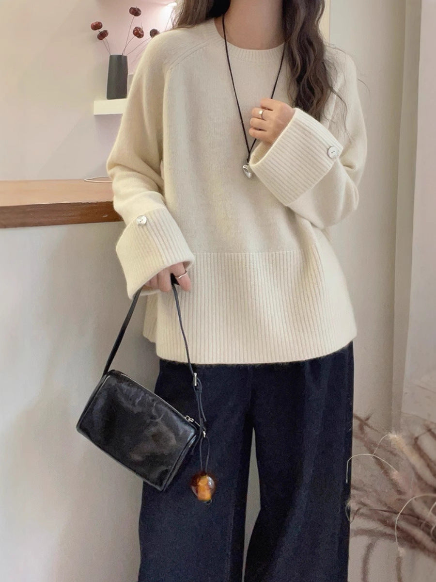Women's oversized fine knit sweater with wide ribbed cuffs, extra wide sleeve endings, and decorative button Chichicherry