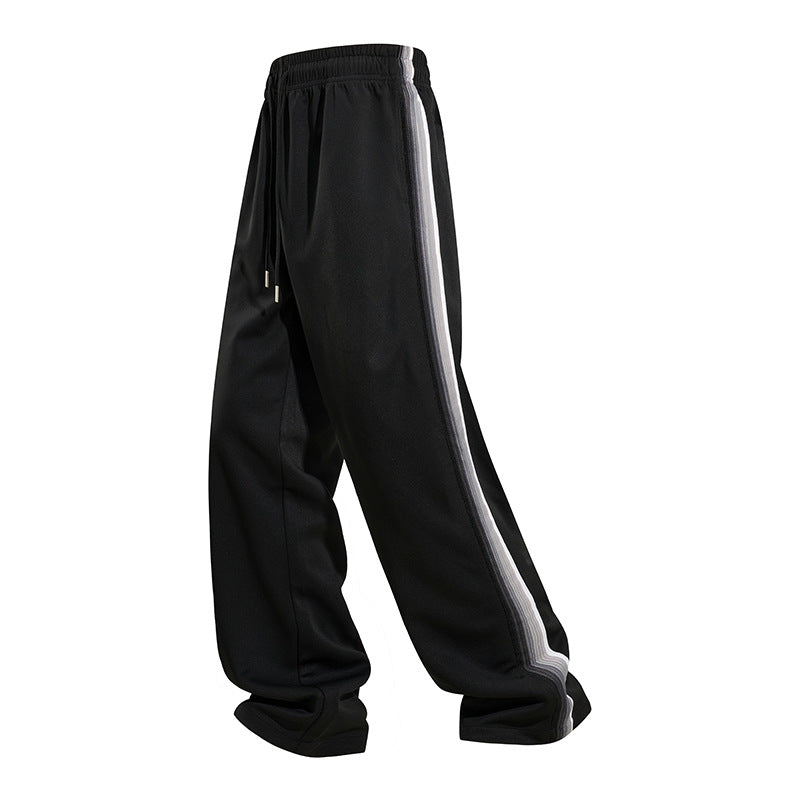 Men's loose baggy training pants with drawstring waistband, elastic comfort waistband, and side stripe detail Chichicherry