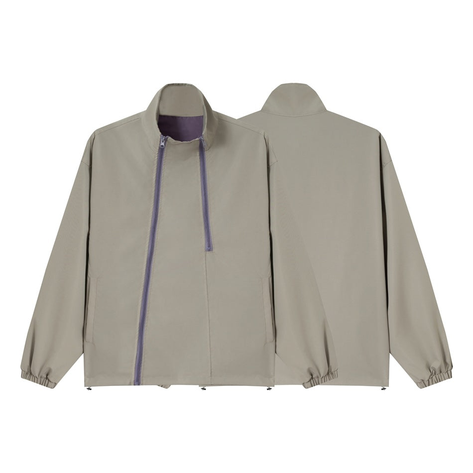Unisex short cut technical windbreaker with asymmetric two-way zipper, detachable storm hood and shoulder mini bag Chichicherry