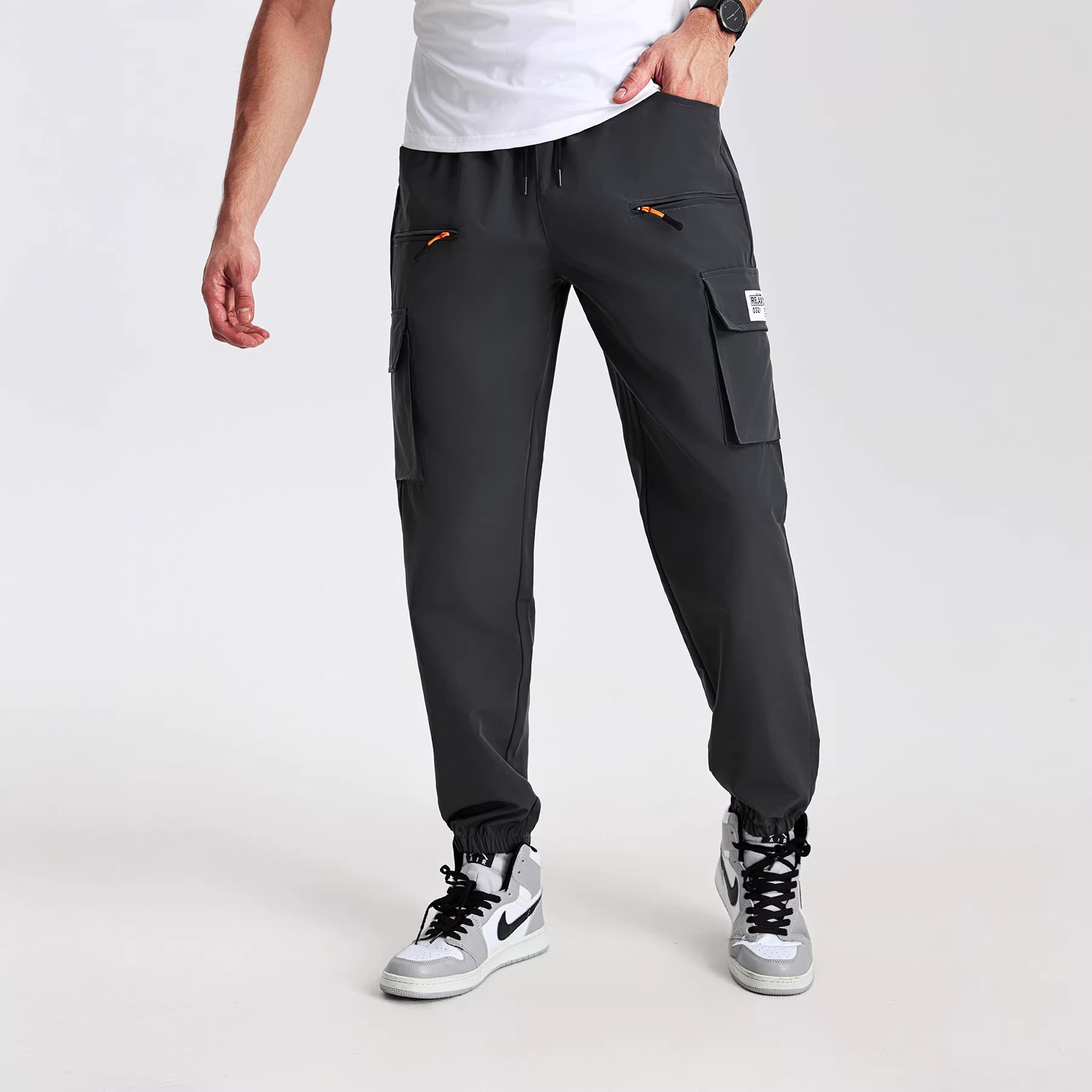 Men's utility cargo pants in jogger style with elastic waistband, multiple pockets & zippered pockets Chichicherry