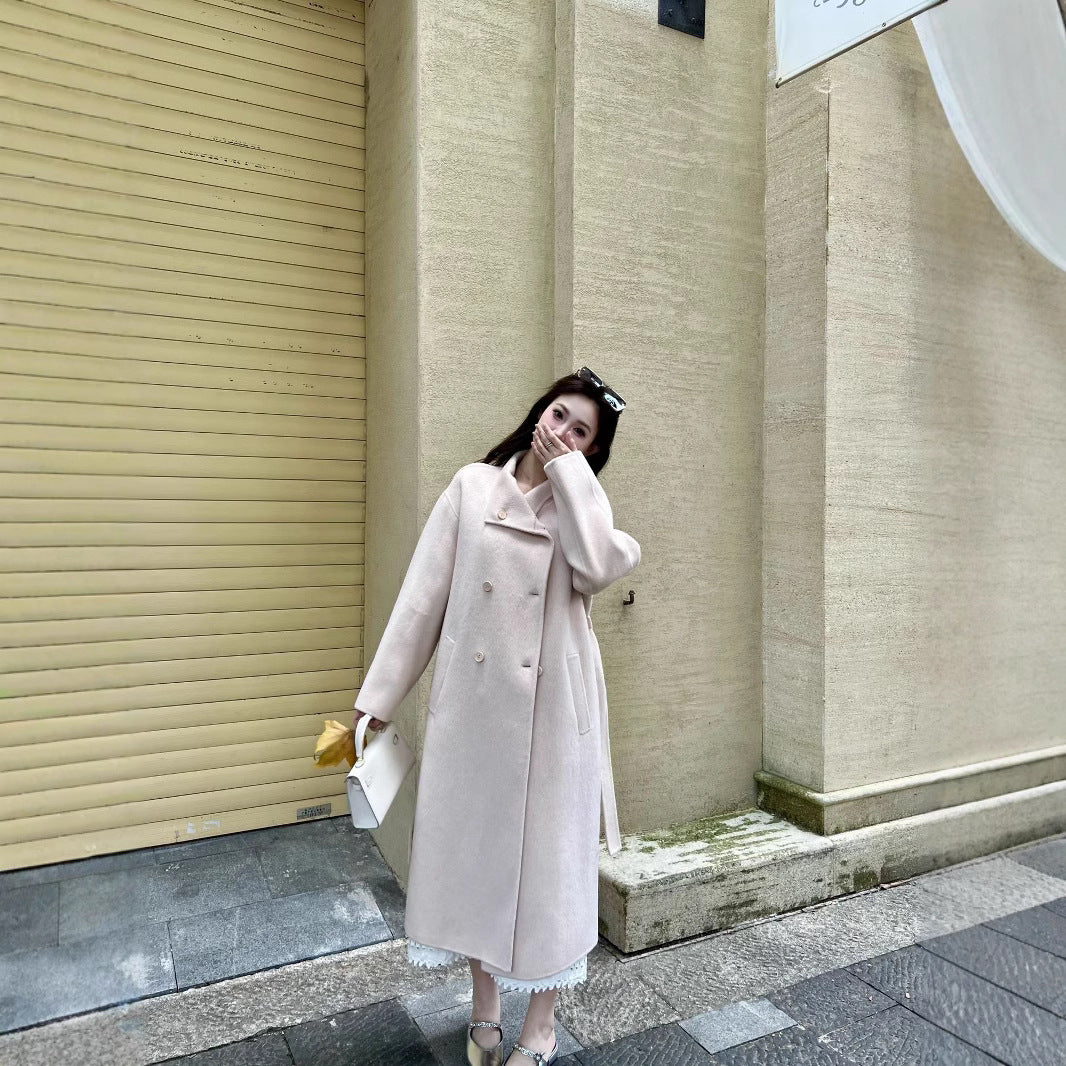 Women’s wool coat with double-breasted button placket, waist belt, and stand-up collar Chichicherry