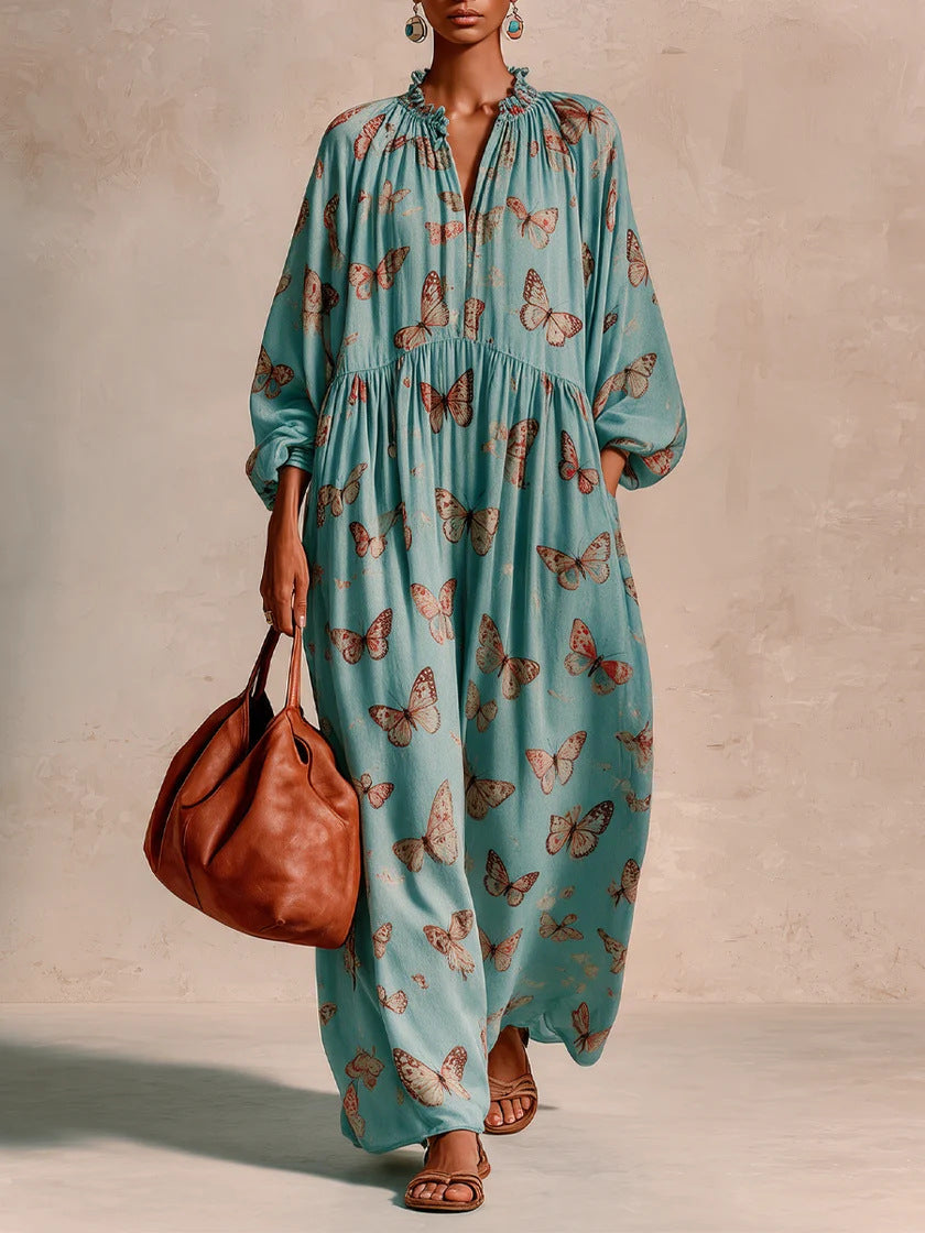 Women’s maxi dress in boho caftan style with butterfly print and gathered empire waist drape