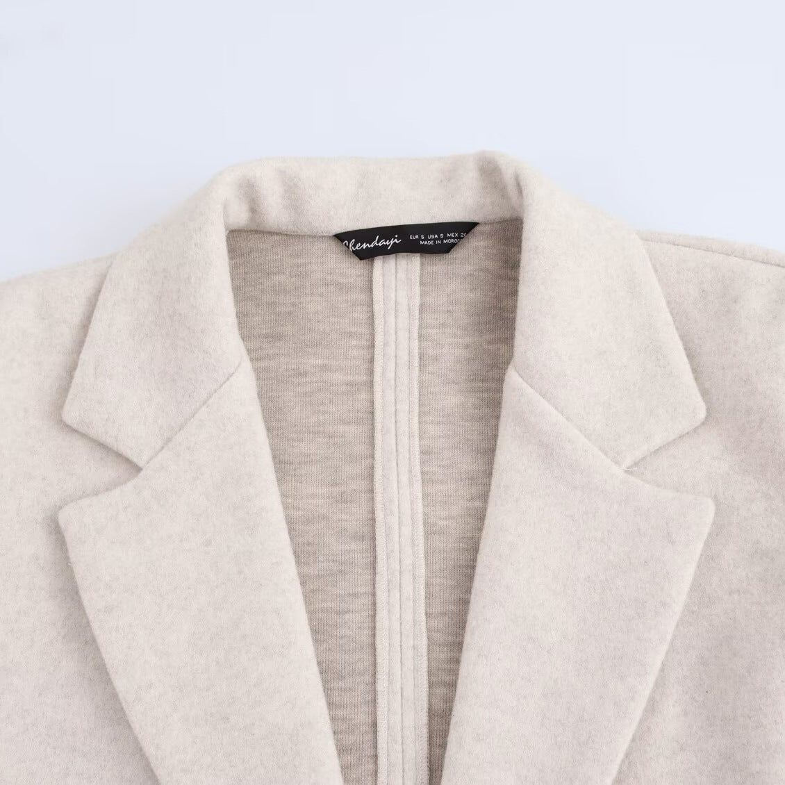 Ladies Purist longline coat with lapel collar, single button closure and soft felt finish Chichicherry