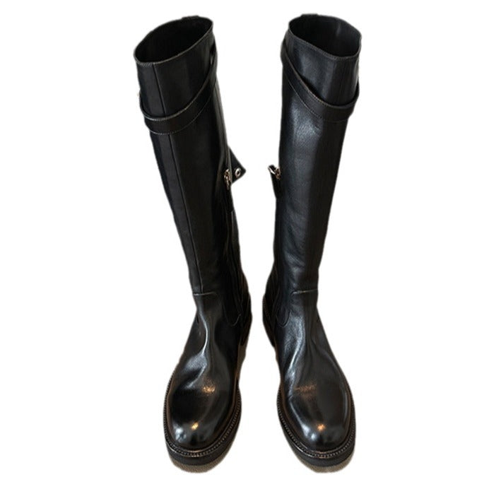 Ladies knee-high leather boots with flat profile sole and decorative strap Chichicherry