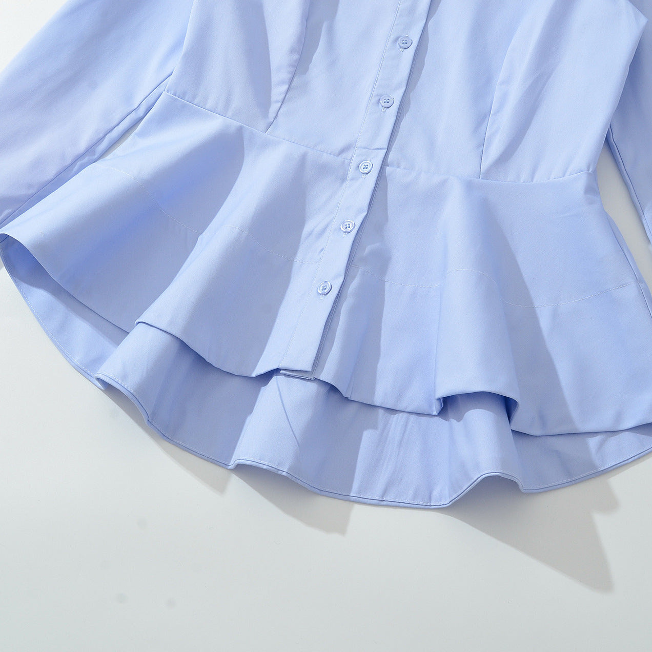 Women's fitted peplum blouse with shirt collar and double-layered hem