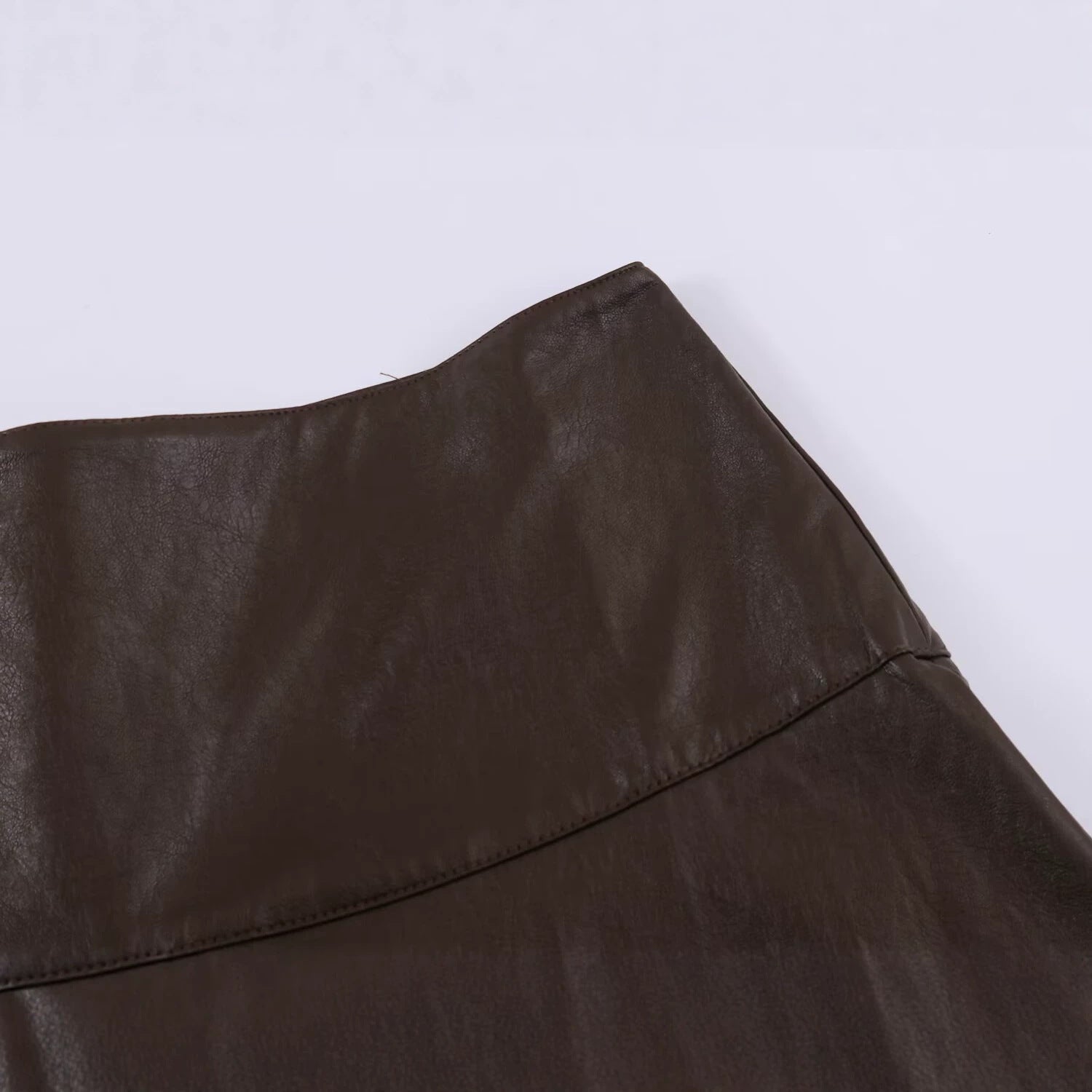 Women's midi skirt made of faux leather with a high waist and flared A-line Chichicherry