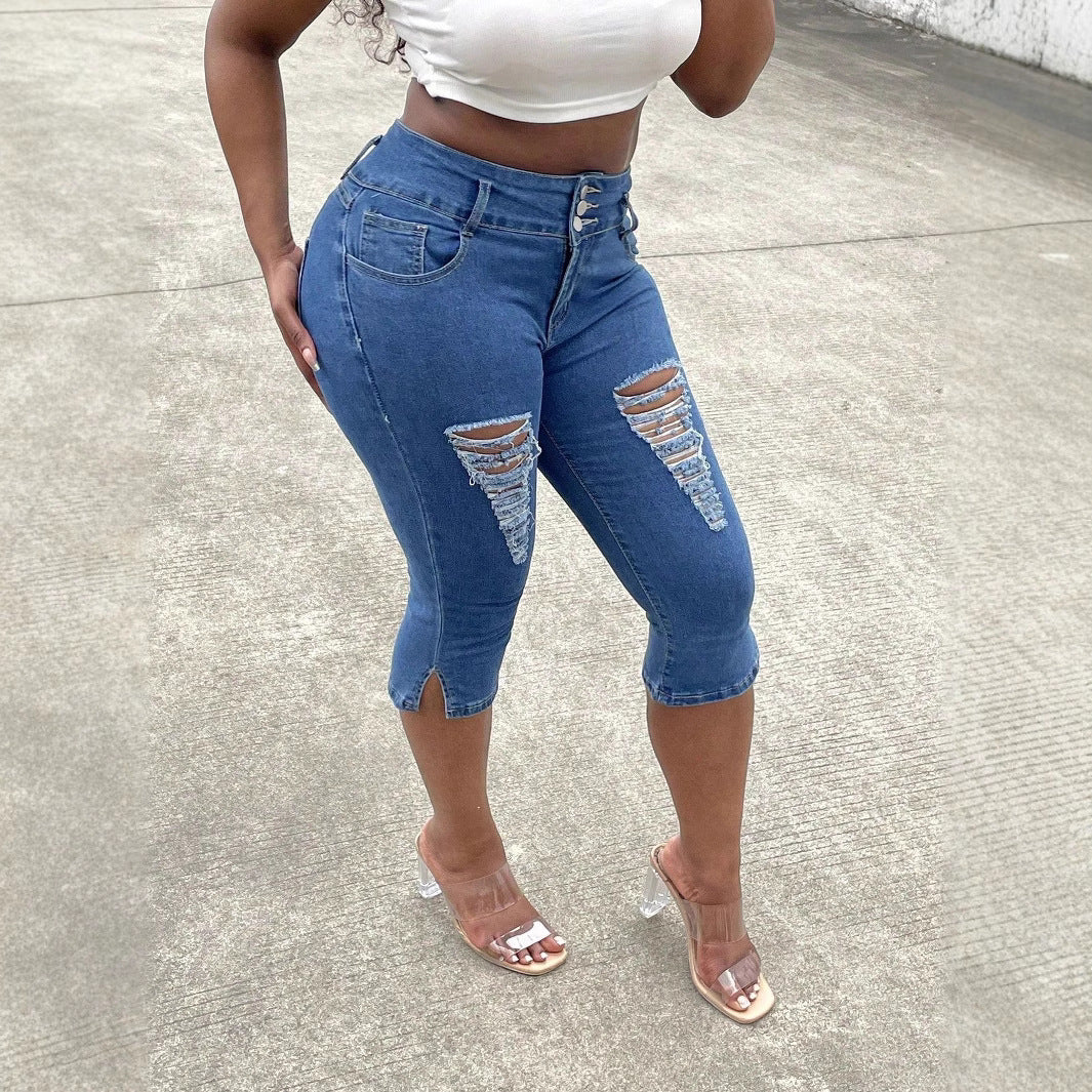 Women's high-waisted, three-quarter length stretch jeans with destroyed inserts and side seam slit Chichicherry