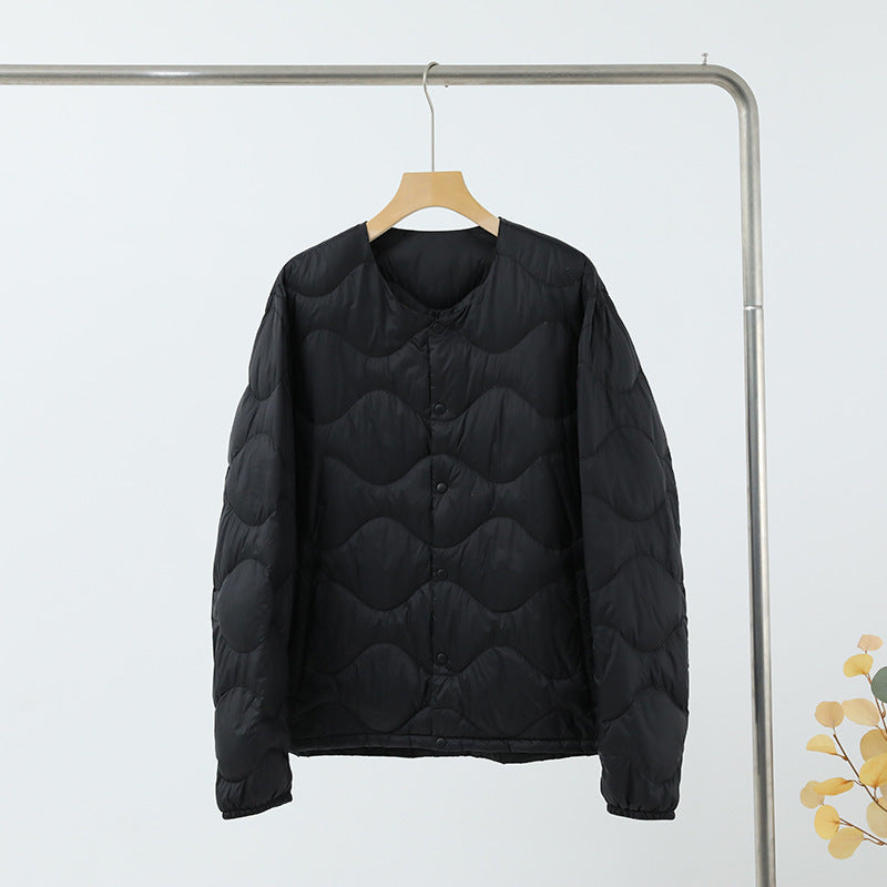 Women’s sleeveless thermal quilted vest with wave-shaped quilting and snap button closure Chichicherry