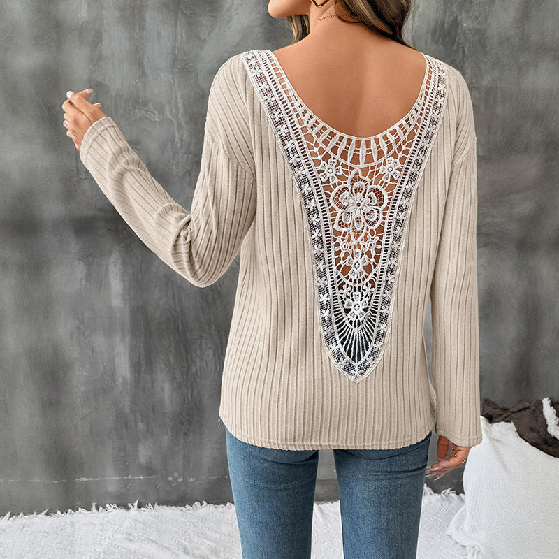 Women's oversized ribbed fine knit sweater with wide boat neck and extended sleeves