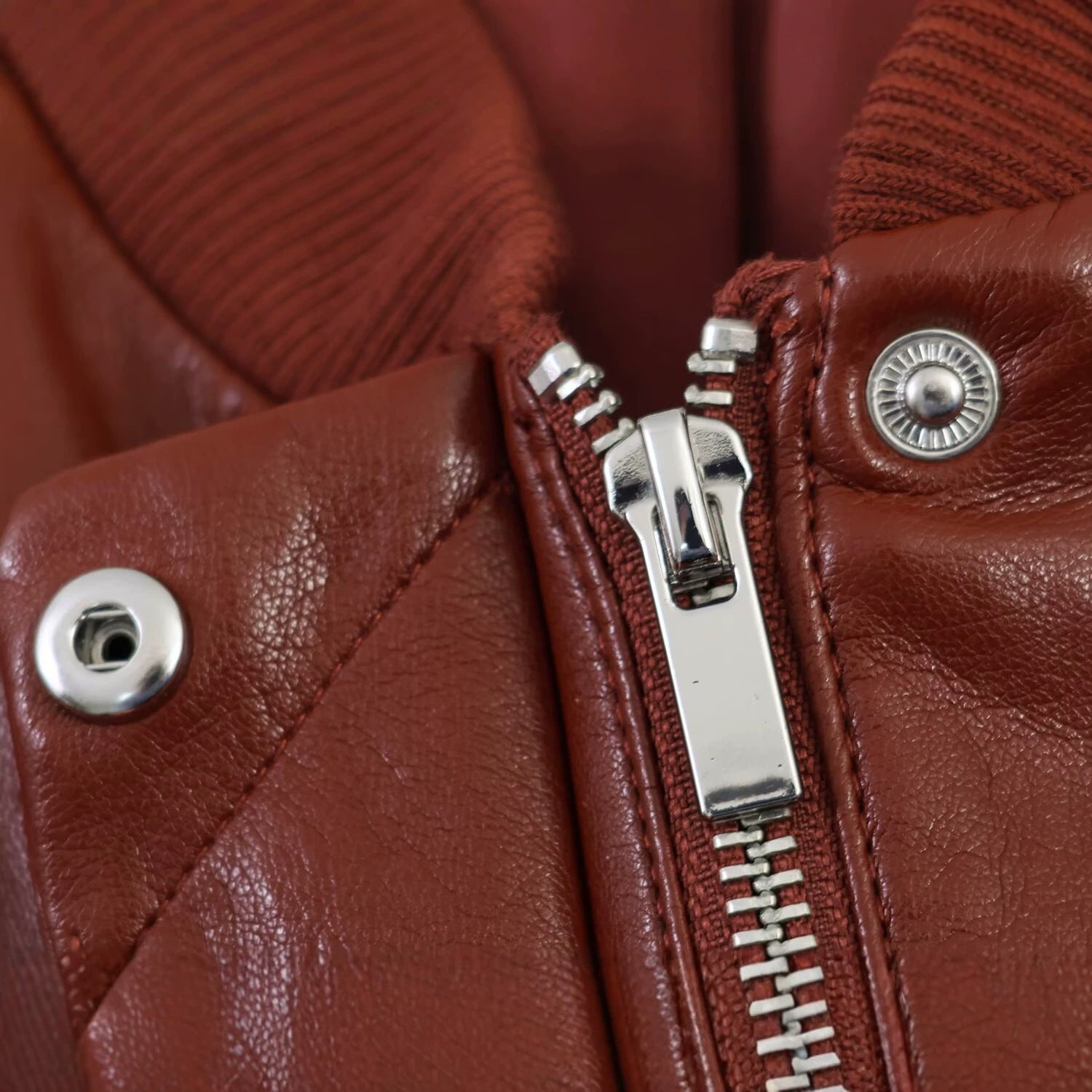 Women's Shiny Faux Leather Bomber Jacket with Ribbed Collar, Concealed Snap Button Placket and Kangaroo Pockets Chichicherry