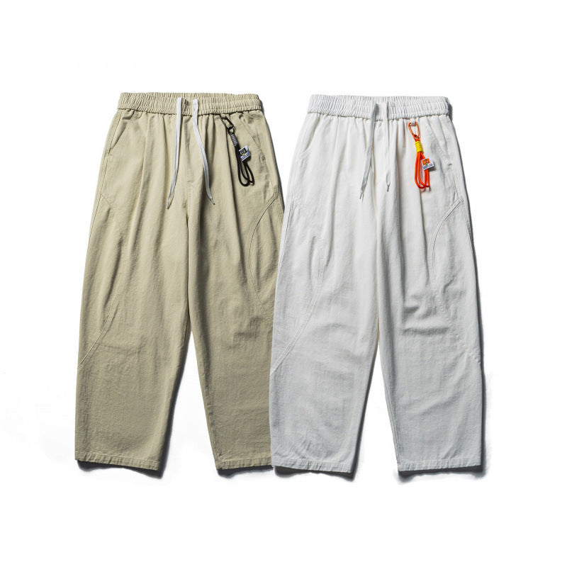 Unisex locker cut cropped leisure pants with elastic waistband, drawstring, and carabiner detail Chichicherry