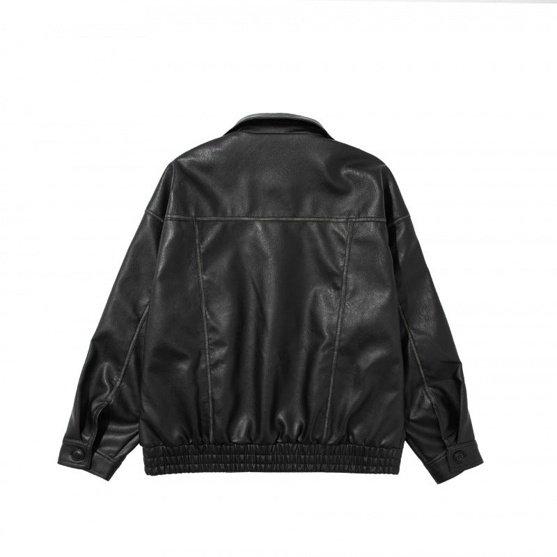 Unisex Short Cut Oversized Faux Leather Blouson Jacket with Shirt Collar, Flap Pockets and Elastic Hem Chichicherry