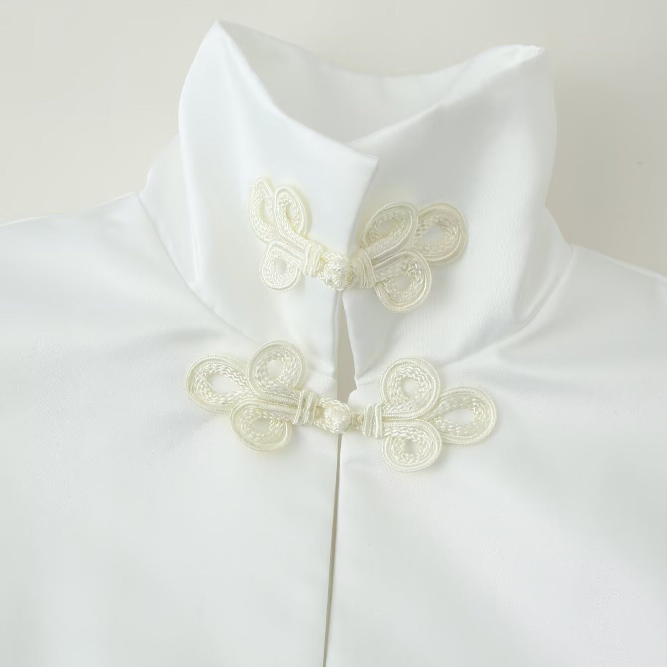 Women's short jacket with stand collar and decorative knot closures Chichicherry