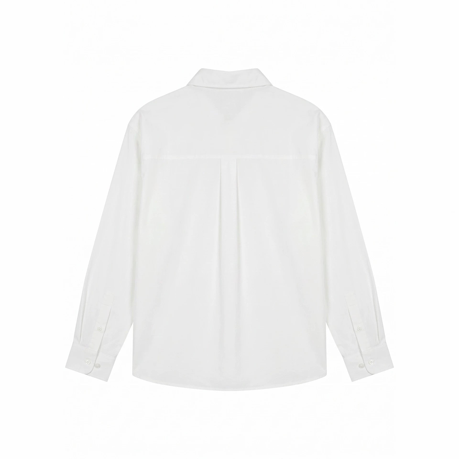 Women's oversized shirt blouse with fine embroidery appliqués and extended hem.
