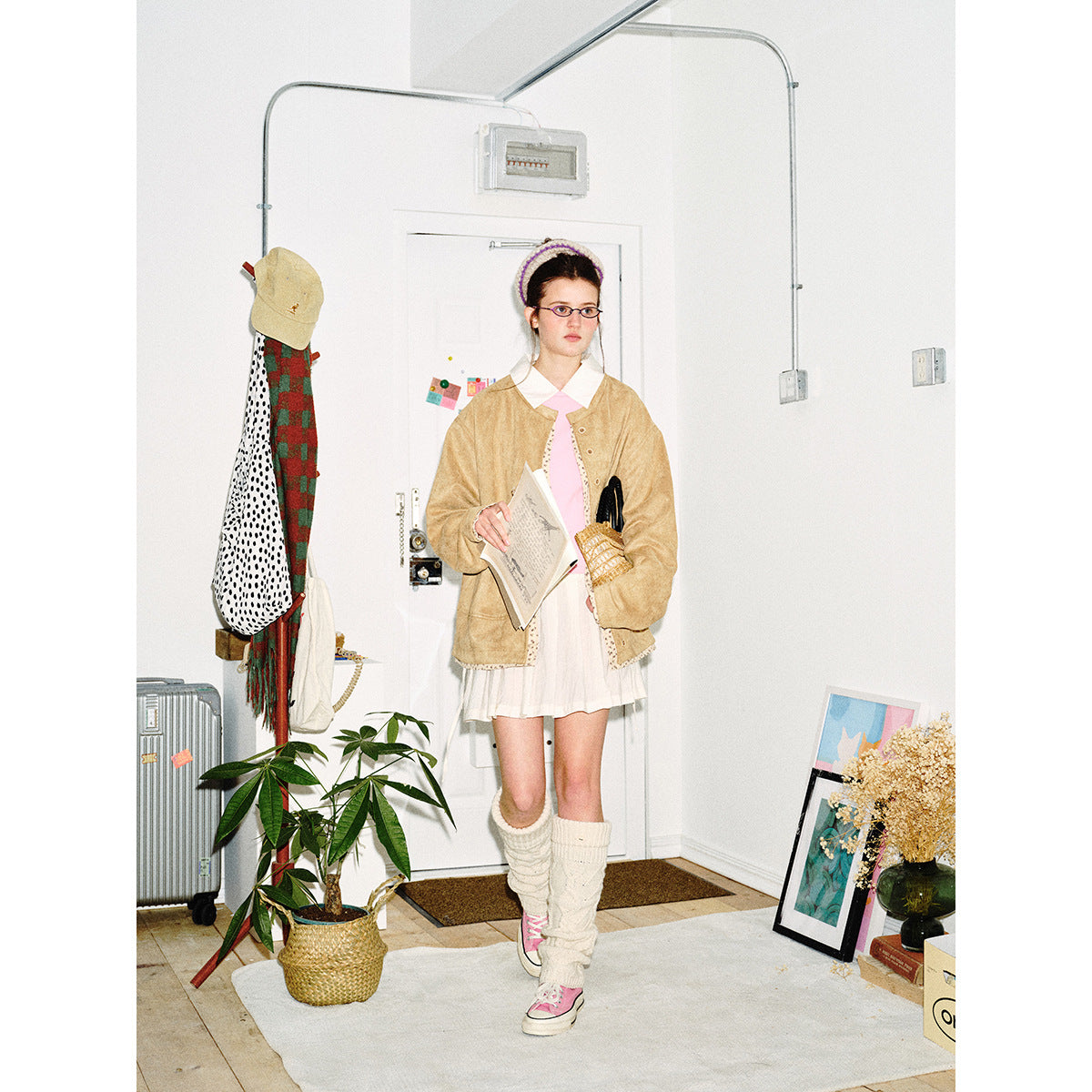 Women's short-cut suede-look blouson jacket with round neck, concealed button placket, and floral inner lining Chichicherry