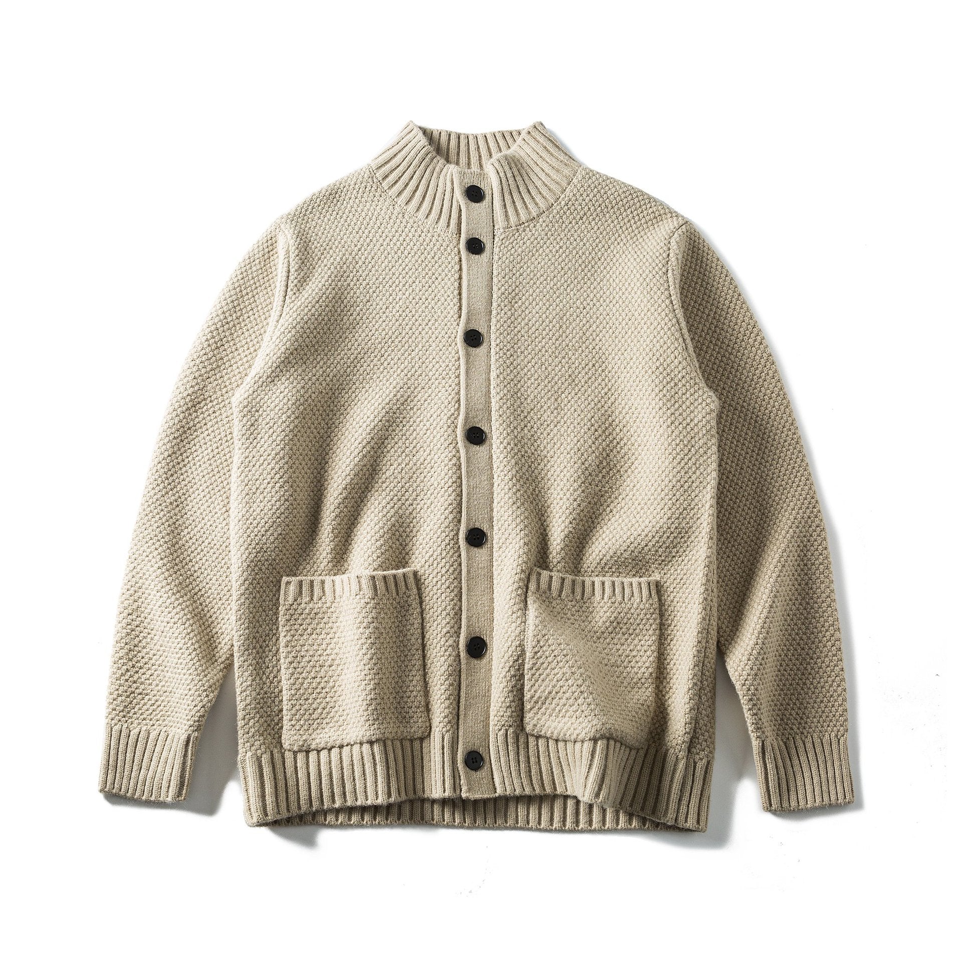 Women's bulky knit cardigan with high ribbed collar, button placket and patch pockets