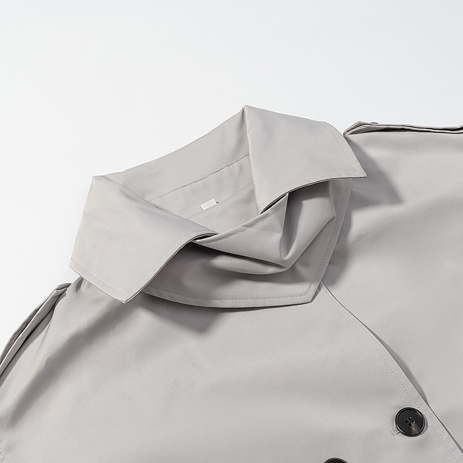 Women's short trench-style jacket with high standing collar, double-breasted front and waist belt Chichicherry