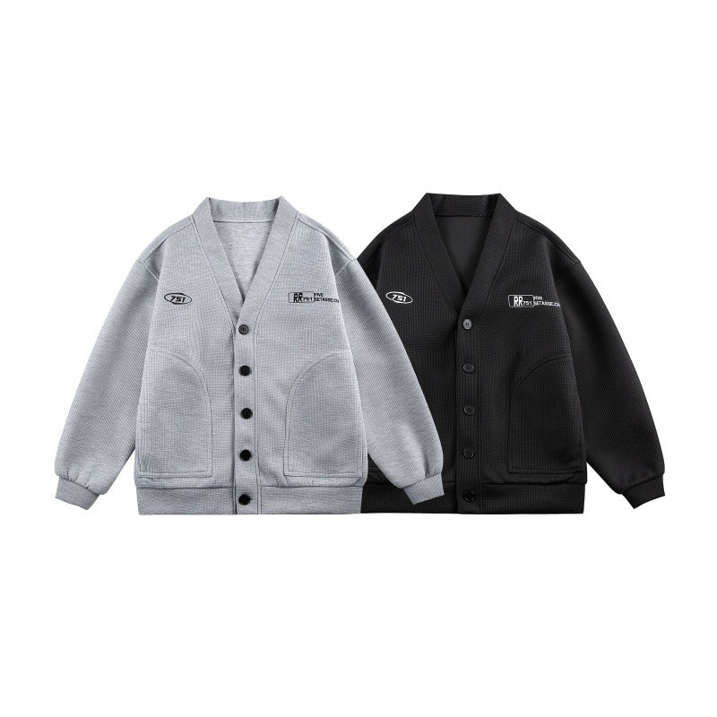 Unisex Boxy knit cardigan in waffle knit with V-neck, continuous button placket, and applied round pockets Chichicherry