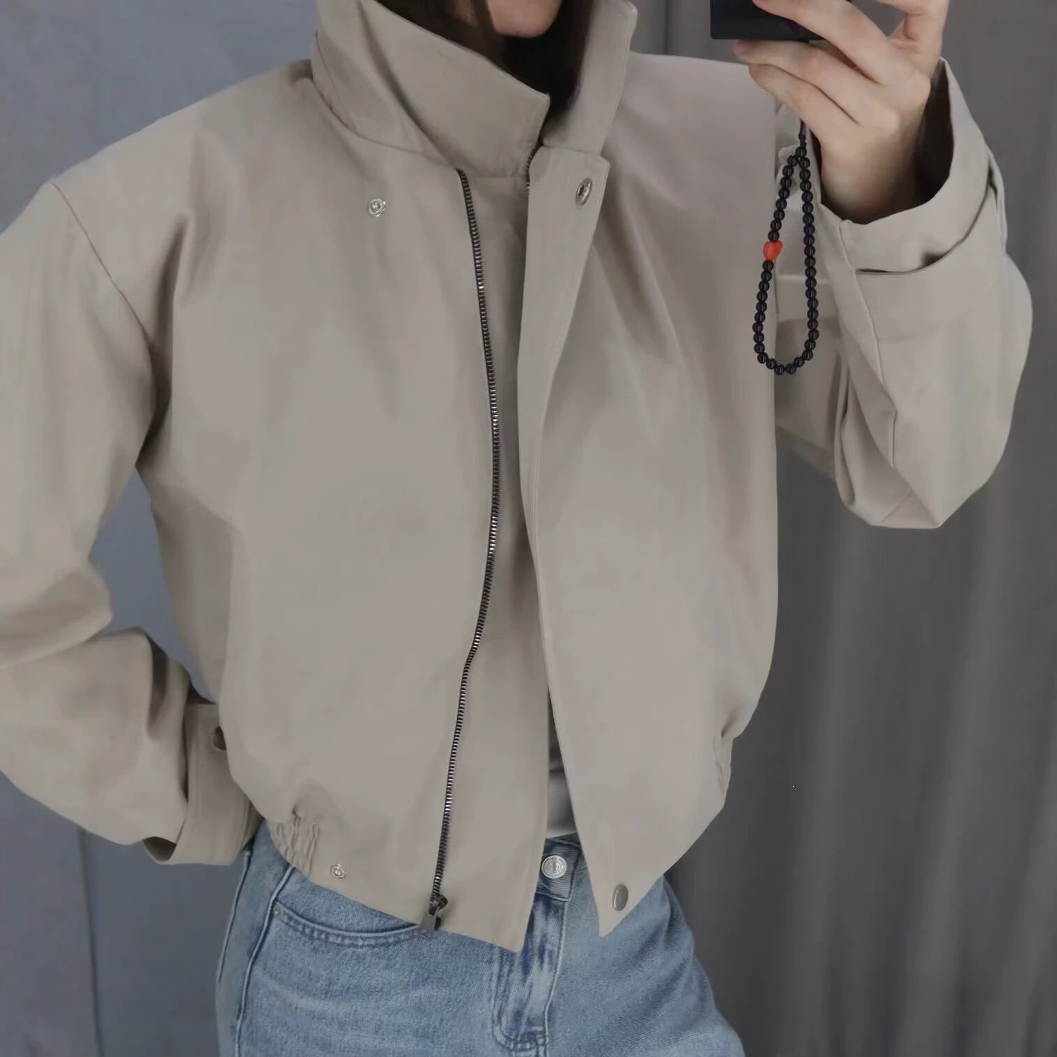 Ladies short jacket with high stand-up collar, elastic waistband and concealed snap button placket Chichicherry