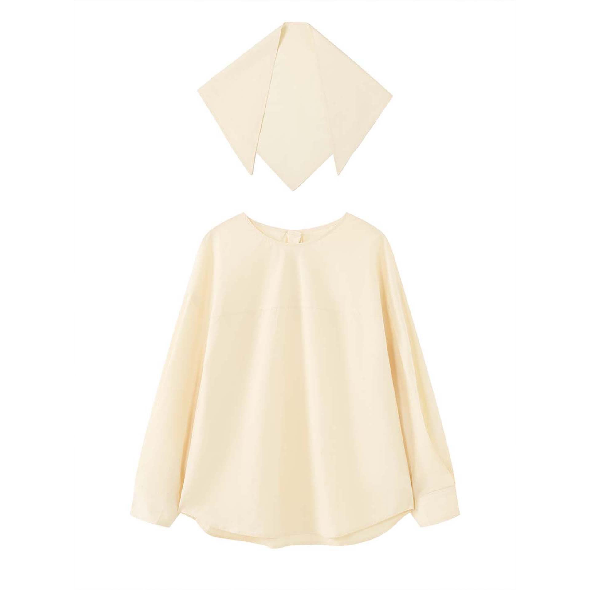 Women loosely cut cotton blouse with wrapped shawl collar and wide cuffs
