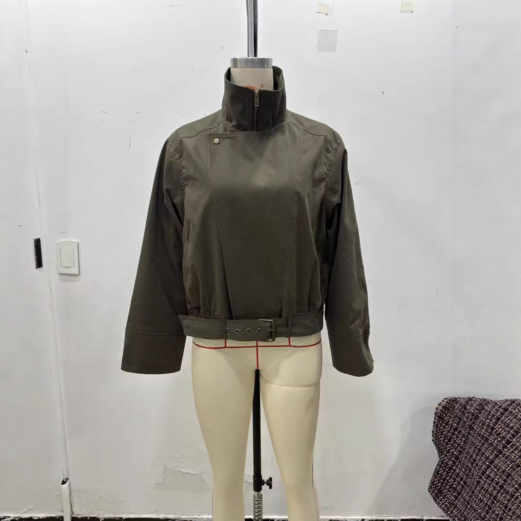 Women's short jacket with high stand-up collar, concealed zipper, and waist belt Chichicherry