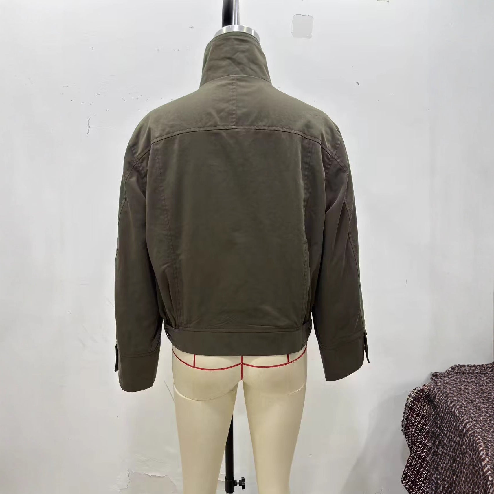Women's short jacket with high stand-up collar, concealed zipper, and waist belt Chichicherry