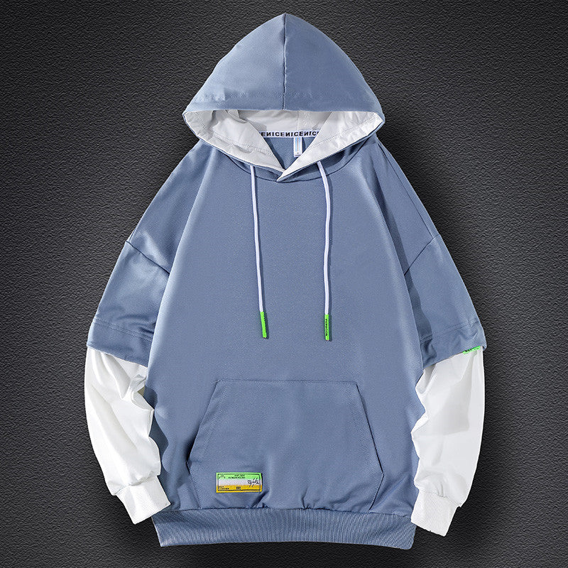 Men's hoodie in layered look with contrast sleeves, kangaroo pocket, and oversized cut Chichicherry