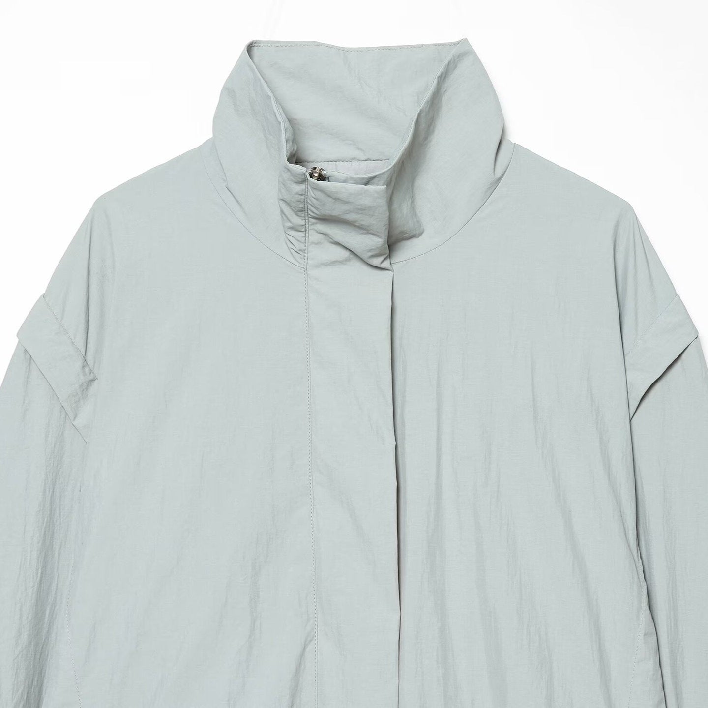 Women’s short jacket in technical minimalist design with high stand-up collar and concealed front flap Chichicherry