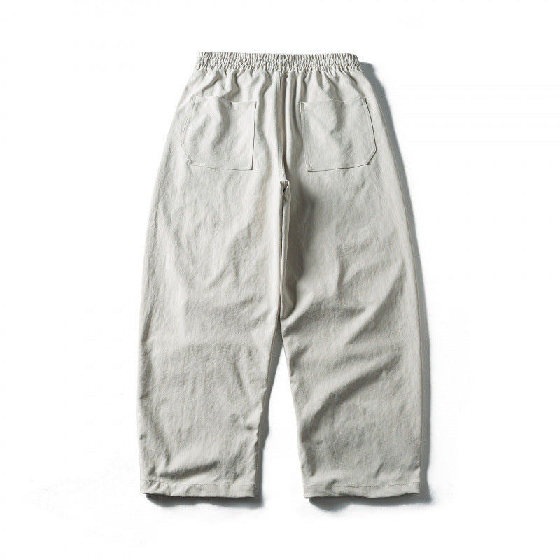Unisex Wide Cropped Pants with Drawstring, Elastic Waistband and Distinctive Seam Panels Chichicherry