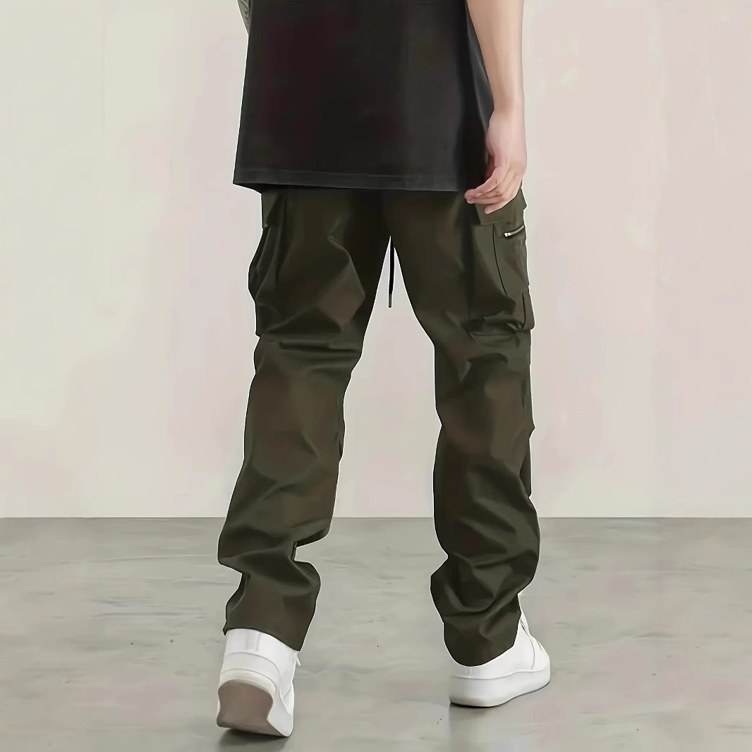Men's wide technical cargo pants with large flap and zip pockets and drawstring waistband Chichicherry