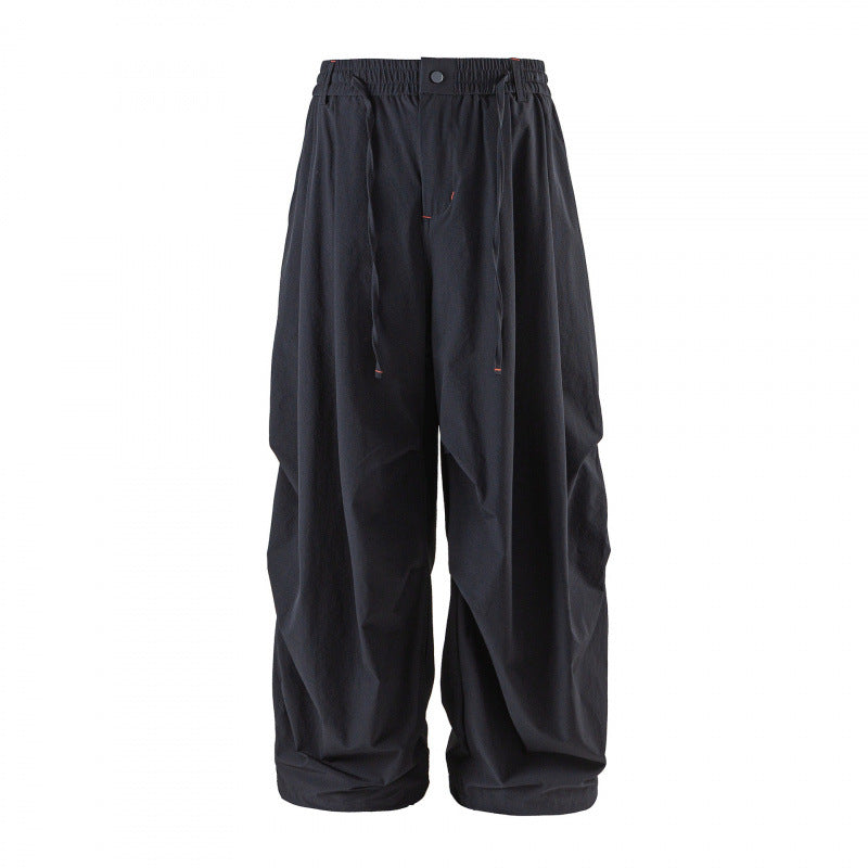 Unisex Loose-fitting technical cargo pants with elastic waistband, drawstring, and zip pockets Chichicherry