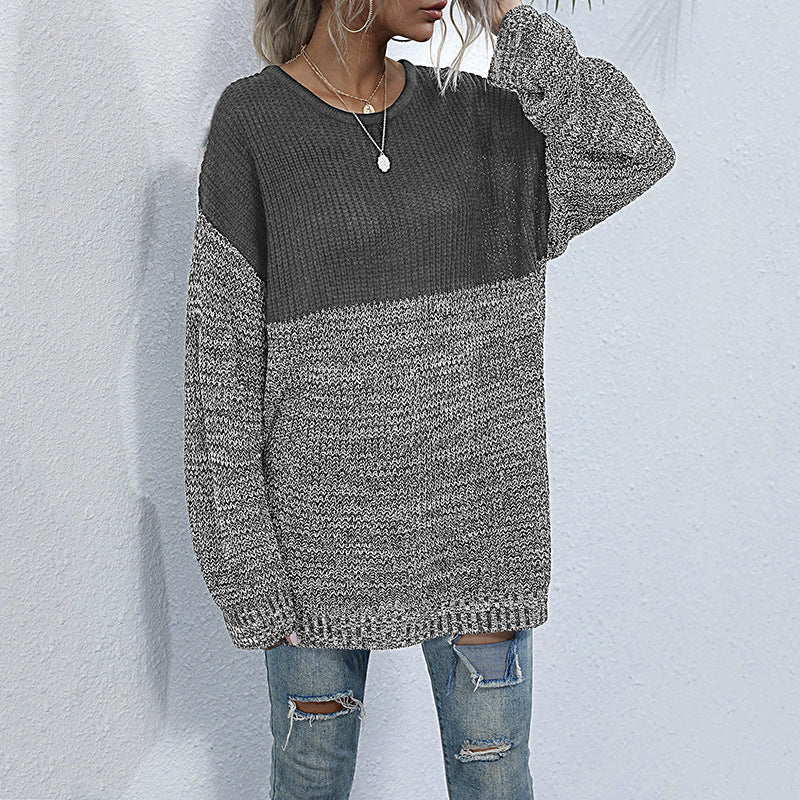 Women's oversized knitted sweater with color block look, round neckline, and mottled textured knit.