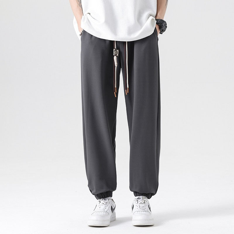 Men's Wide Jogging Pants in a Loose Fit with Adjustable Drawstring, Elastic Ankle Cuffs, and Soft Touch Chichicherry
