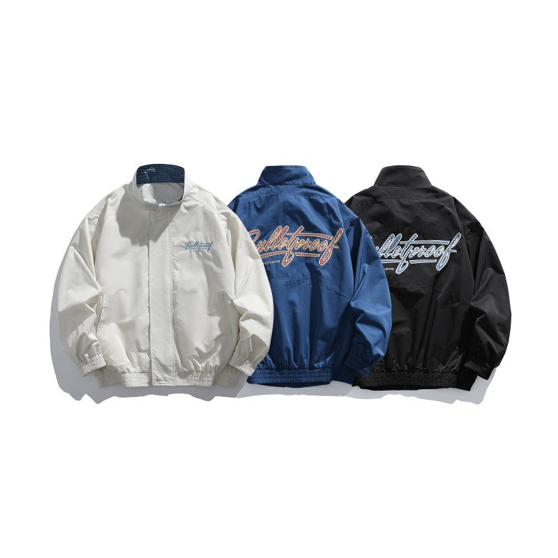Unisex Lightweight Boxy Blouson Jacket with Stand-up Collar, Elastic Cuffs and Embroidered Chest Detail Chichicherry