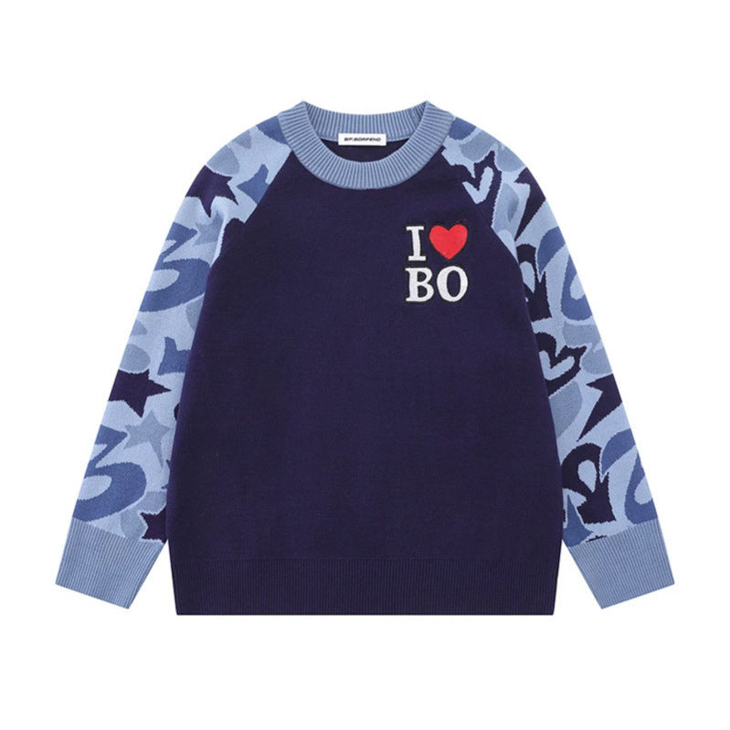 Women's knit sweater with raglan sleeves, statement jacquard sleeves, and ribbed hem Chichicherry