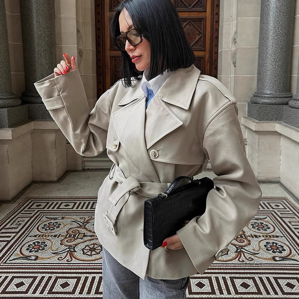 Women's short trench-style jacket with a tailored tie belt and wide sleeves Chichicherry