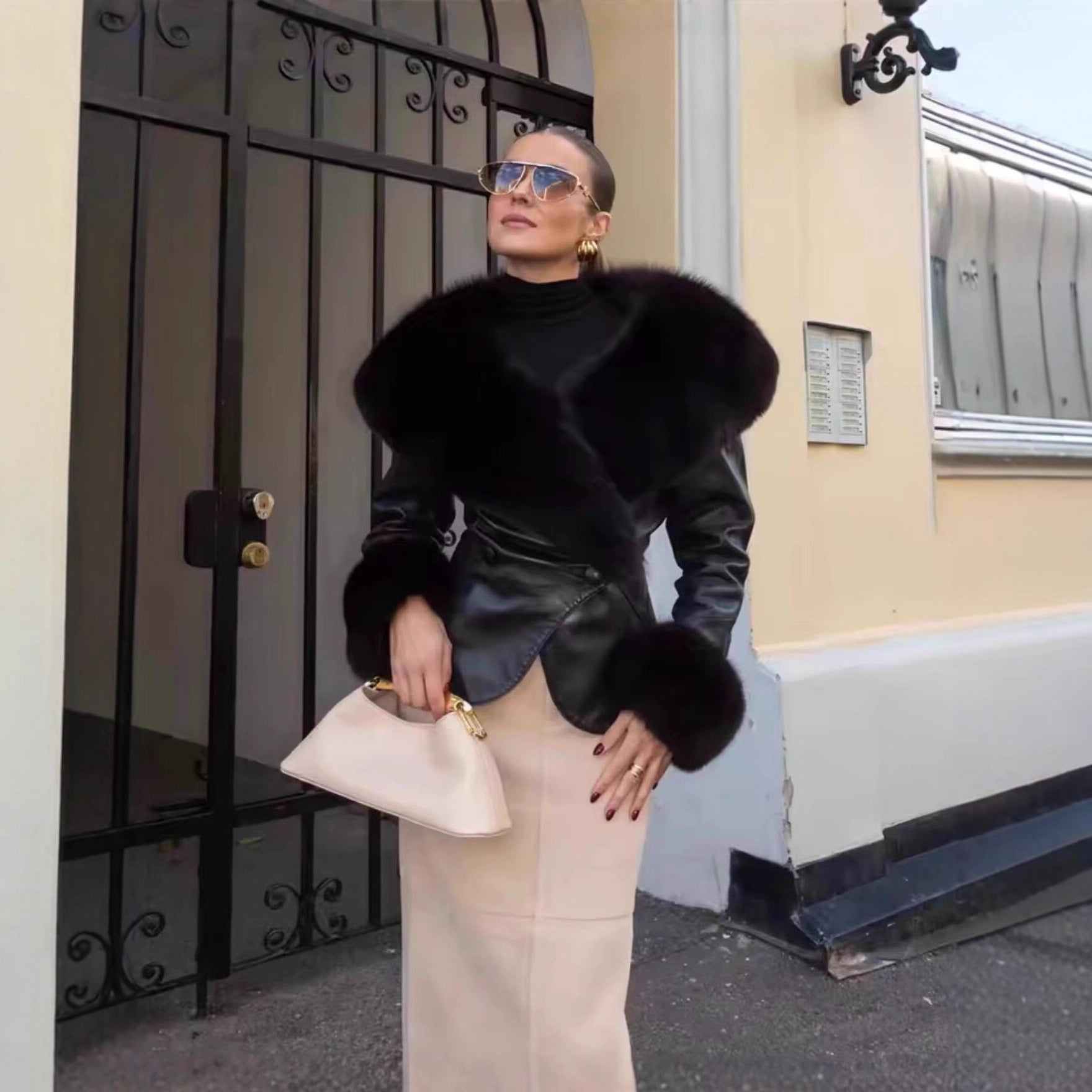 Women's short jacket made of synthetic leather with voluminous faux fur collar and fur cuffs Chichicherry