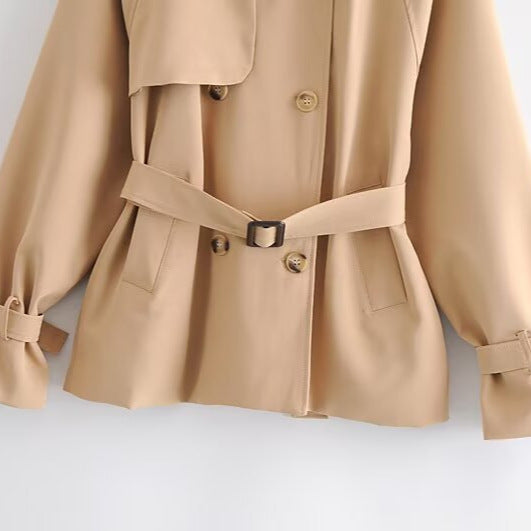 Women Short Tailored Trench Coat with Tied Belt, Asymmetrical Storm Flap and Cuff Strap Chichicherry