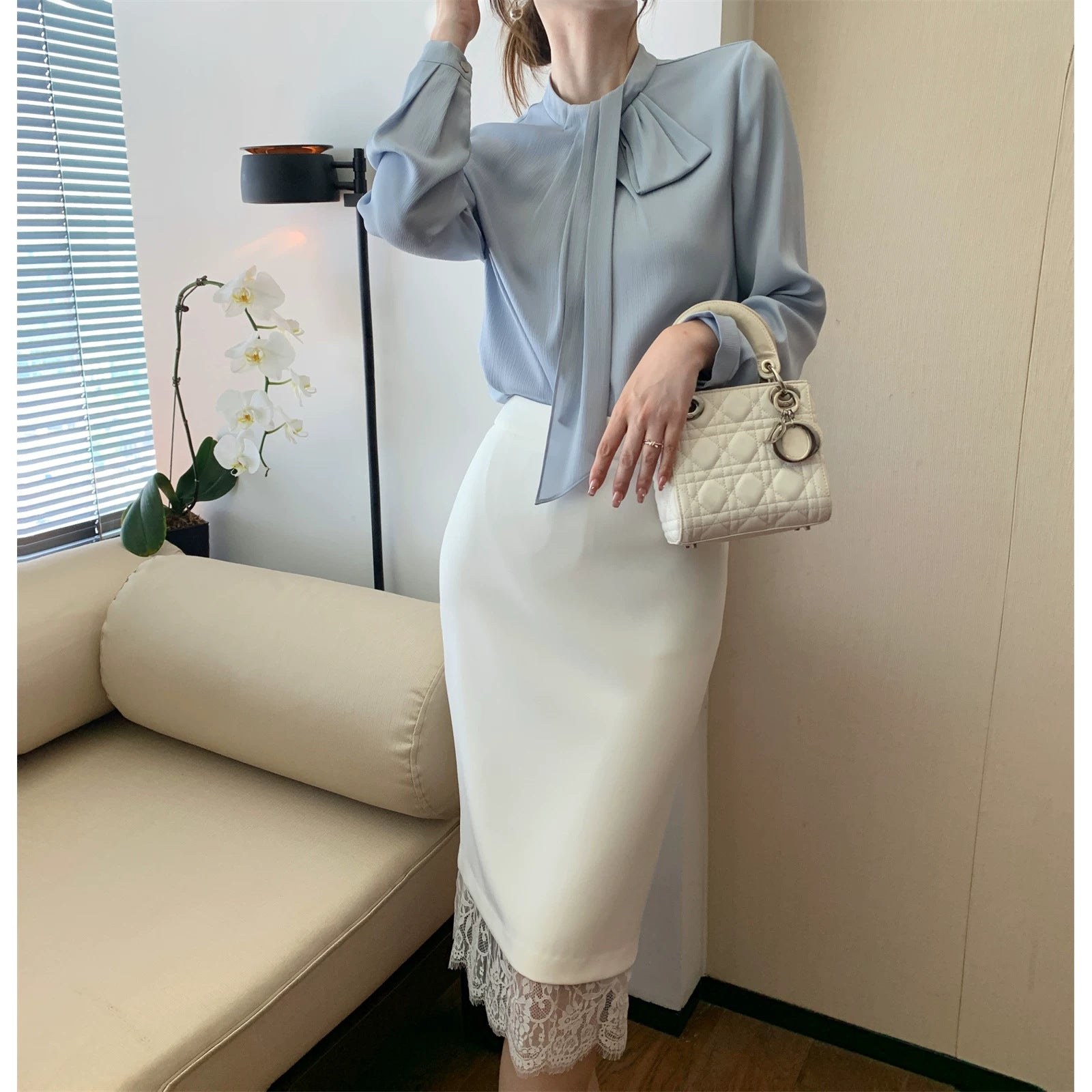 Women Elegant and figure-hugging blouse with bow detail Drune