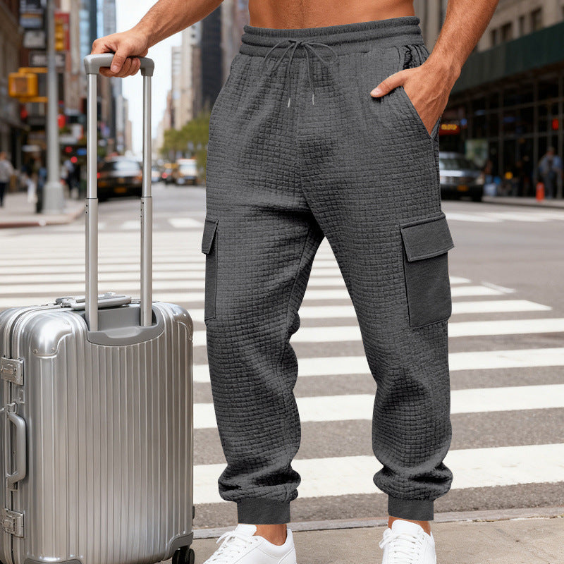 Men's cargo joggers with distinctive waffle texture, elastic waistband, and large flap pockets Chichicherry