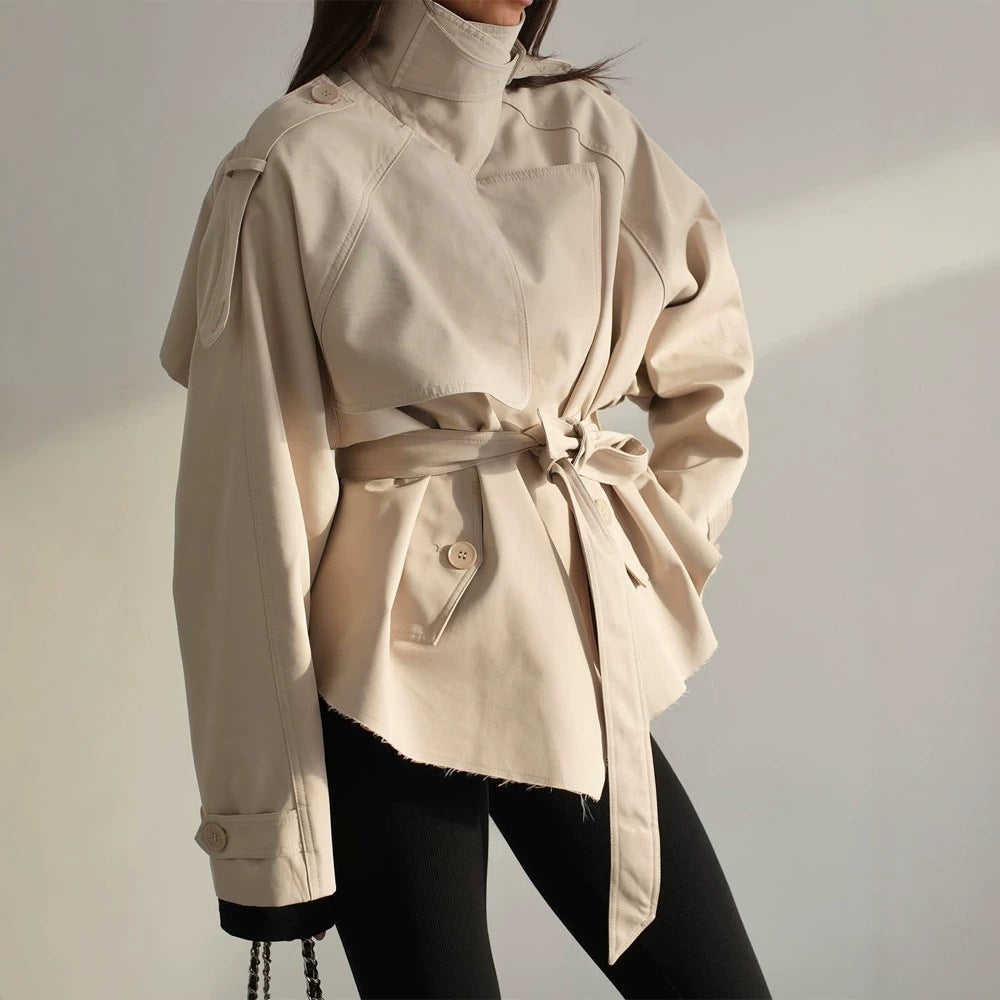 Women's short trench coat with wide standing collar, shoulder epaulettes, and waist belt Chichicherry