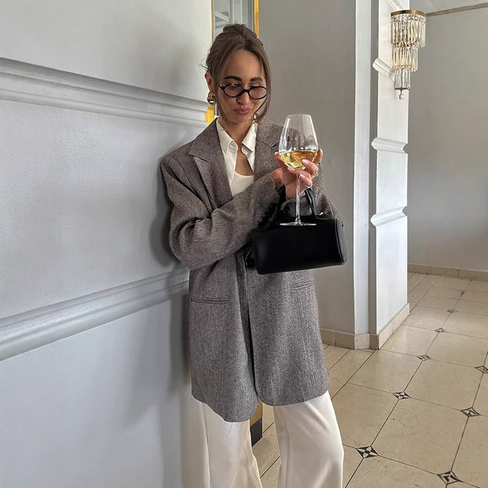 Women's long oversized wool blend coat with single-breasted button placket, notched lapels, and side pockets Chichicherry