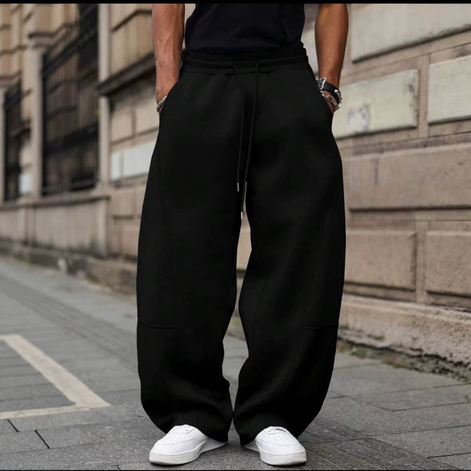 Men's loose sweatpants in baggy cut with elastic waistband, drawstring, and side pockets Chichicherry