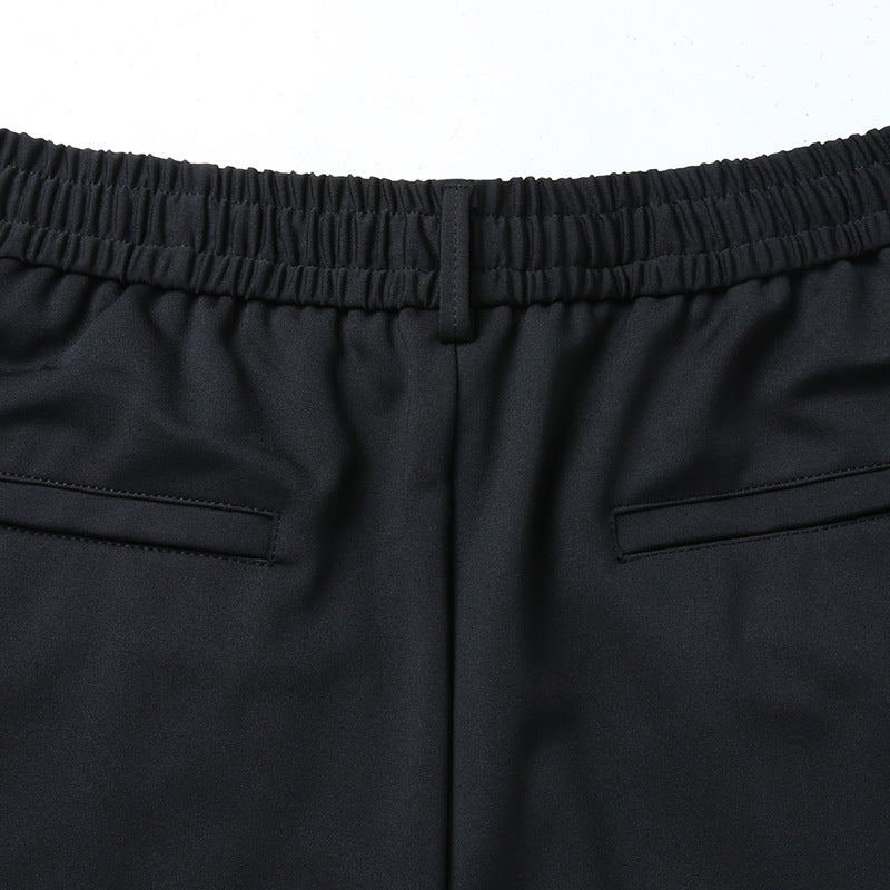 Men's leisure pants with elastic waistband, tapered cut and zippered pockets Chichicherry