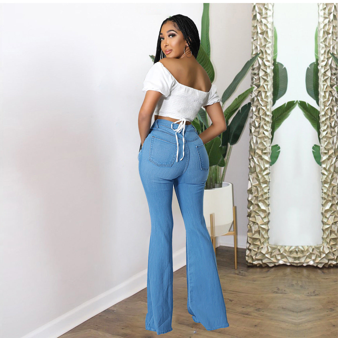 Women's high-waisted flared pants made of stretch denim with knee rips and shaping waistband Chichicherry