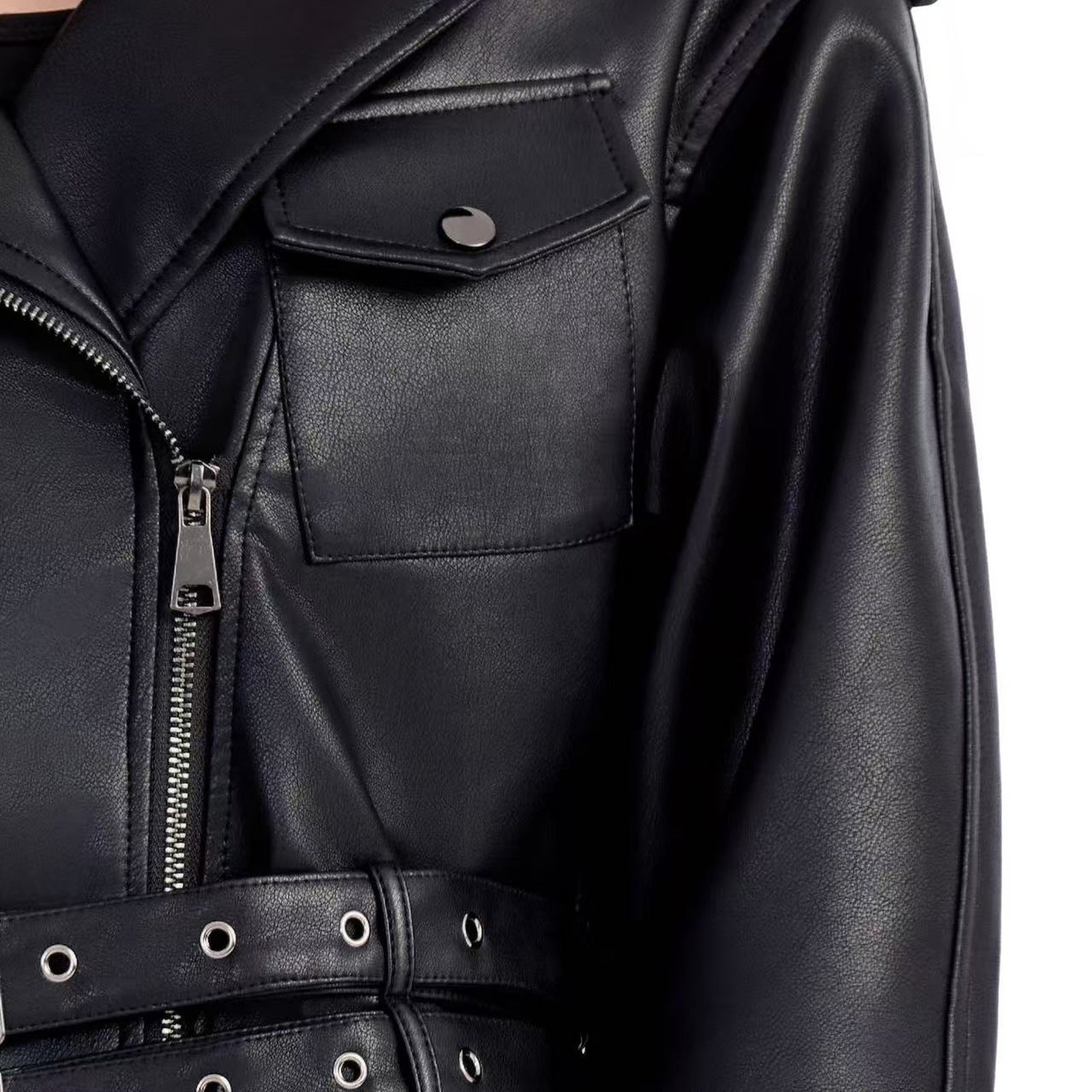 Ladies short fitted biker jacket made of faux leather with double waist belt, epaulettes and zipper details Chichicherry