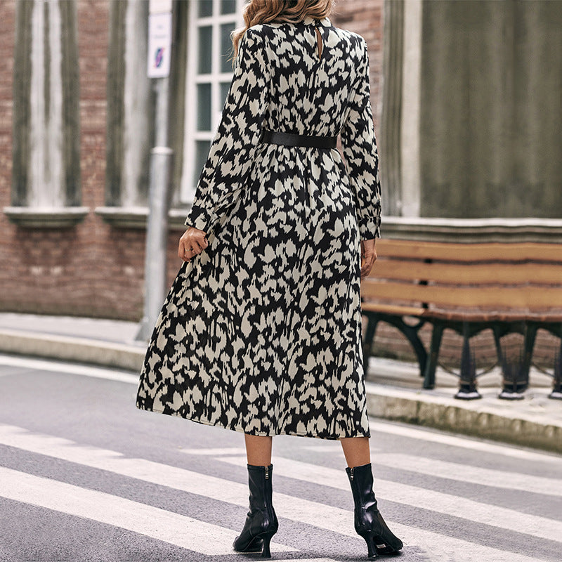 Women's midi dress with animal-inspired print, stand collar and fitted belt Chichicherry