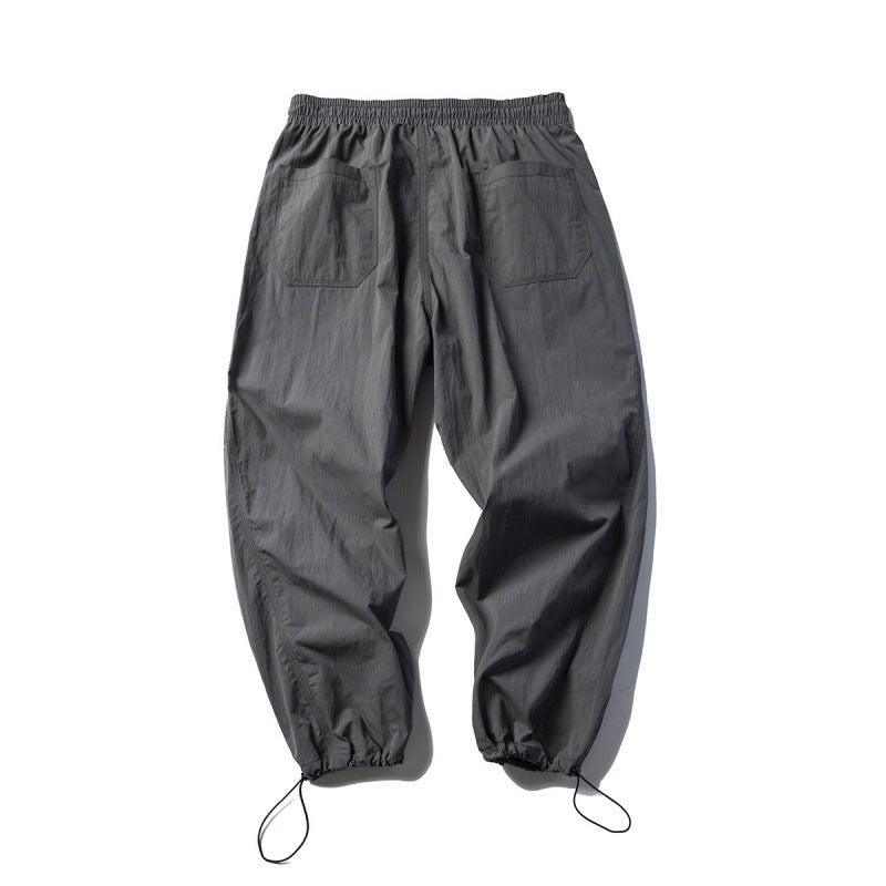 Unisex Technical Cargo Pants in Baggy Cut with Drawstring Waist and Adjustable Leg Closures Chichicherry