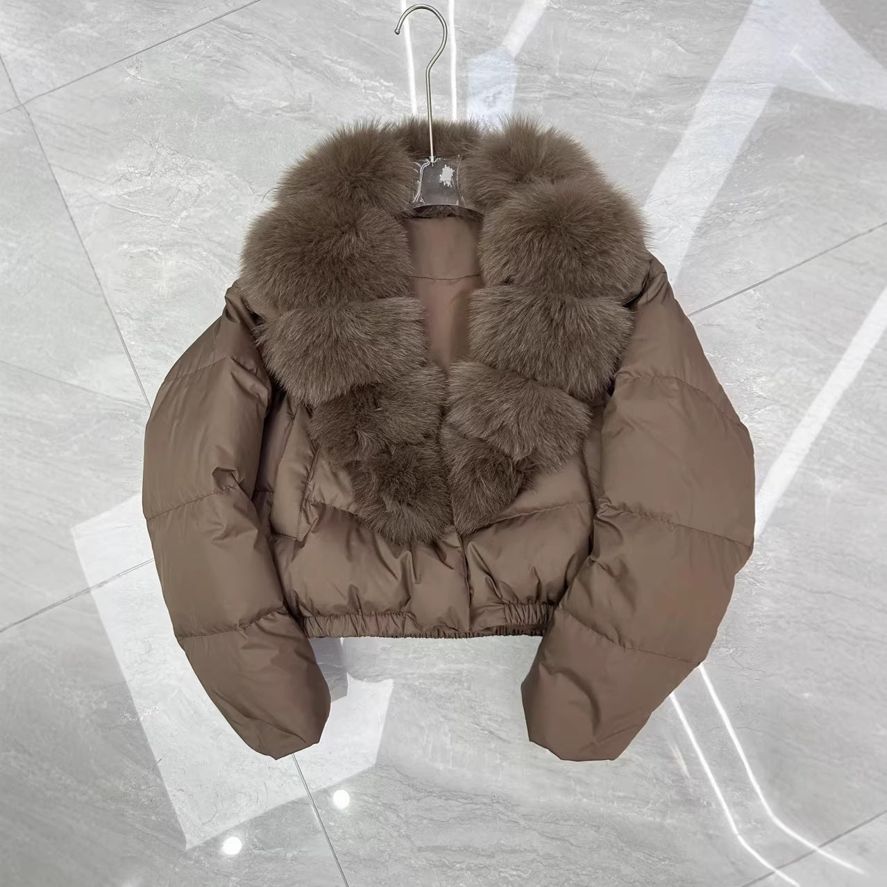 Women's short cut boxy puffer jacket with extra large faux fur collar and shape-stable hem Chichicherry