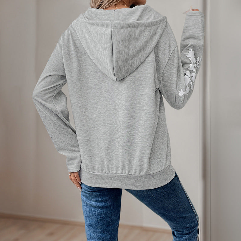 Women's hoodie with half zipper, kangaroo pocket & floral sleeve appliqués Chichicherry